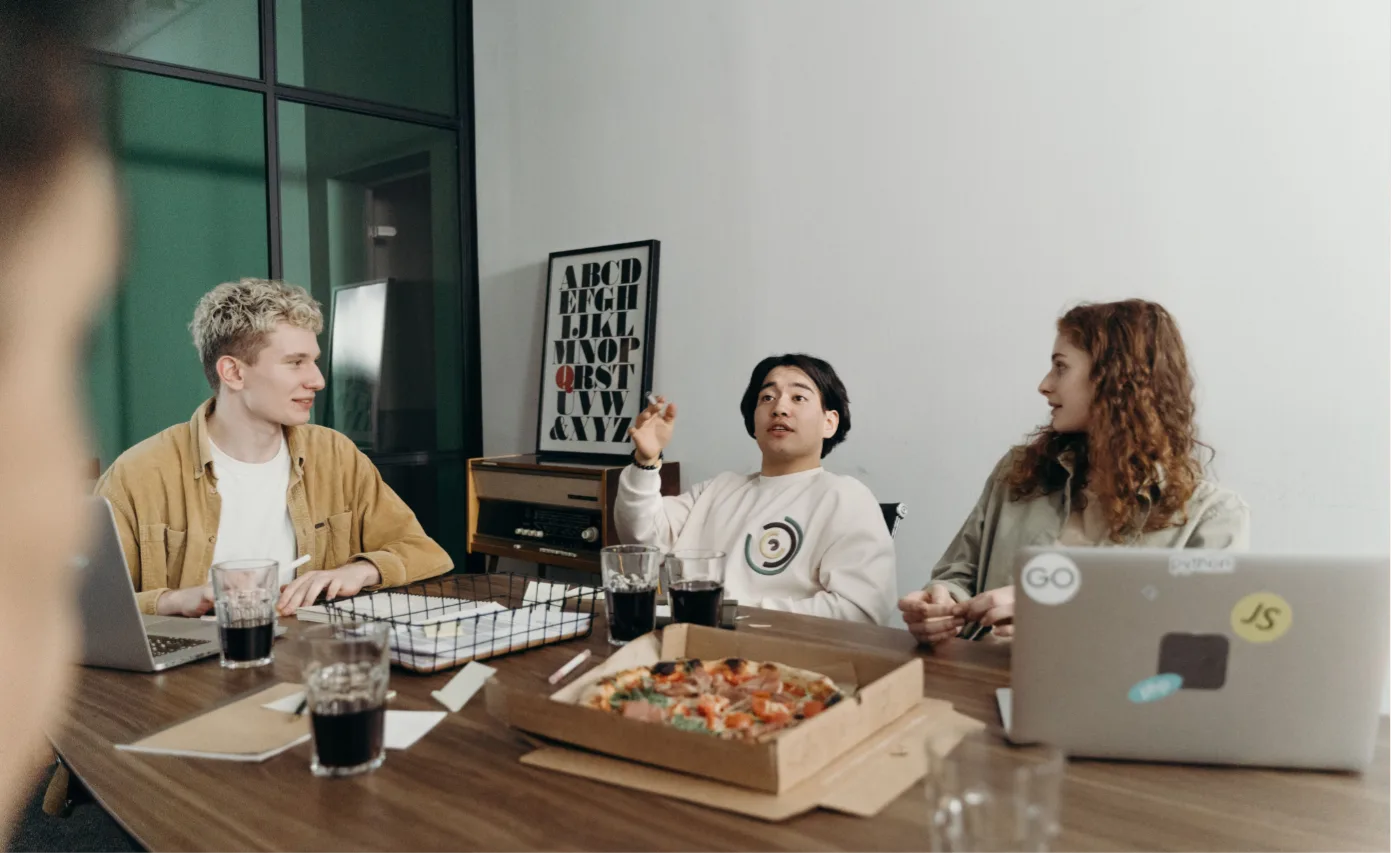 The Bitcube team together over lunch in the office